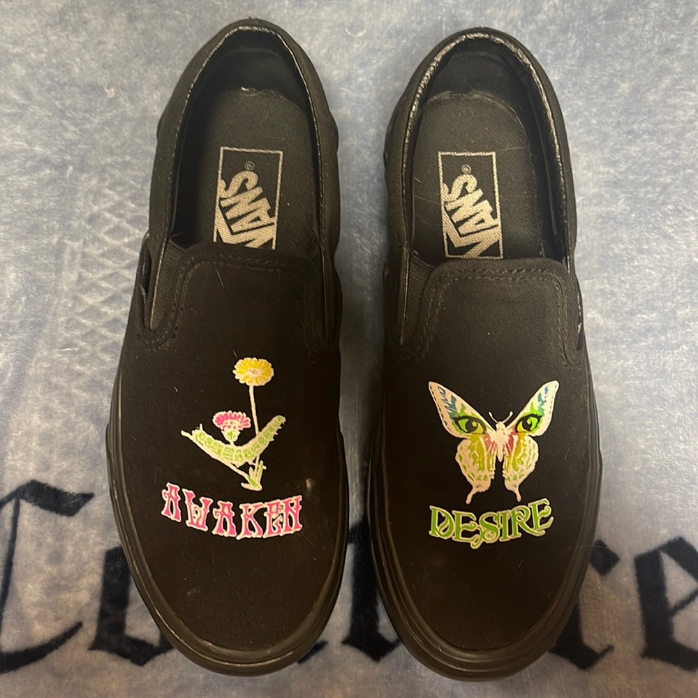 Black glow in the dark vans with butterfly & flower pattern.